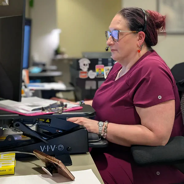 Jaime working at the front desk at Summit Dental Care