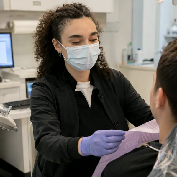 Sol providing attentive chairside support during a dental appointment