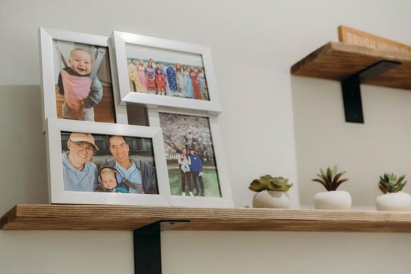 Family photos and decorations on shelves at the Summit Dental Care office